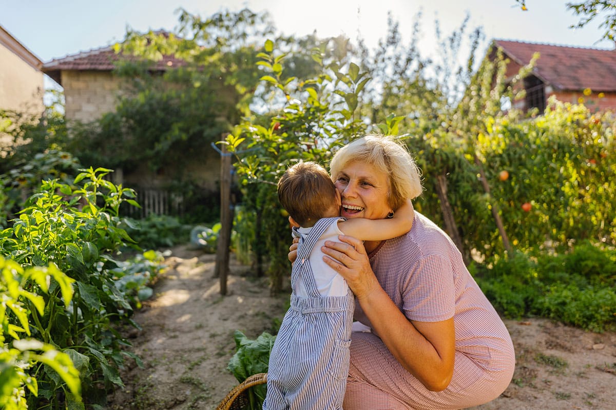 Grandmother with grandchild in garden