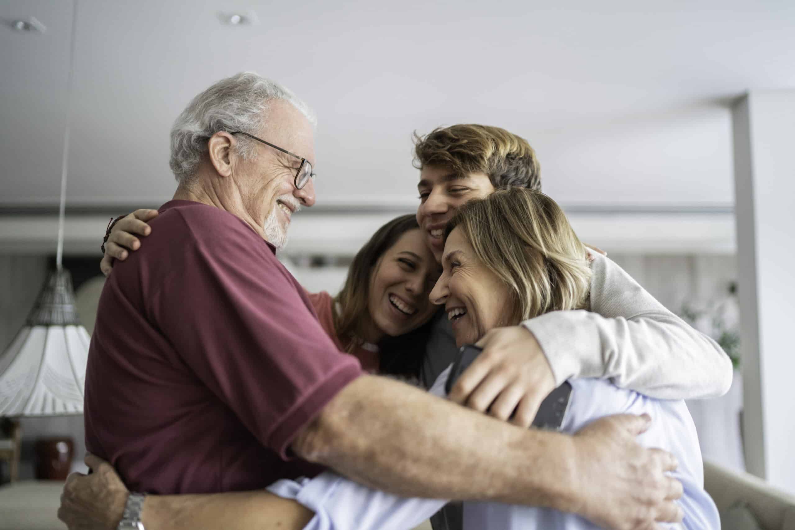 Grandparents and grandchildren embracing