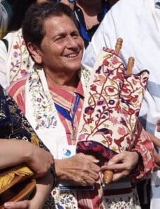 Liz holds a torah