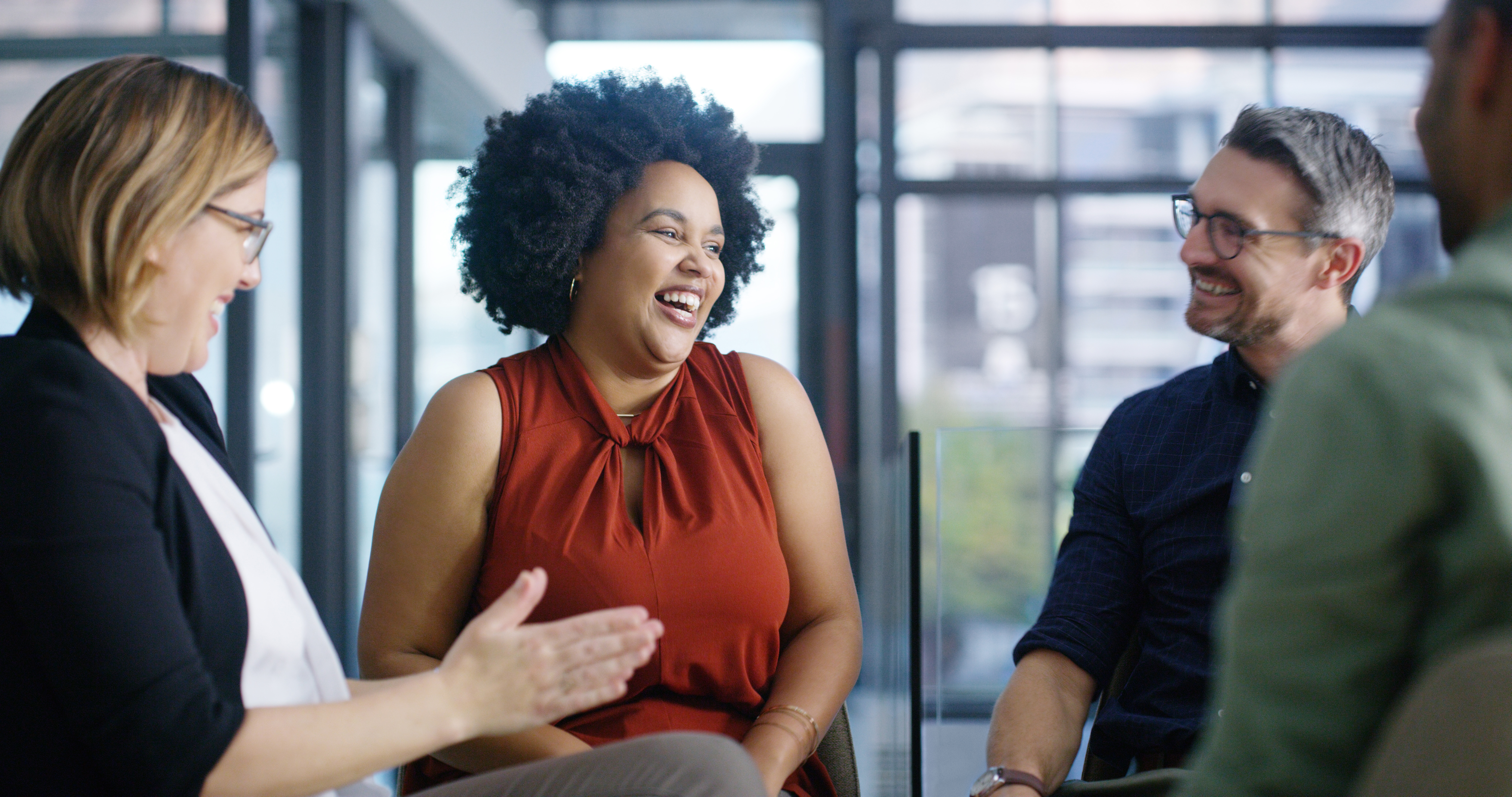 A group of businesspeople having a discussion in an office