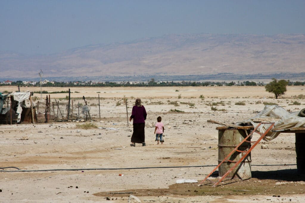 Bedouin woman walks in the desert in southern Israel