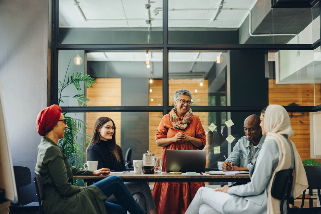 Five professionals having a meeting in a boardroom