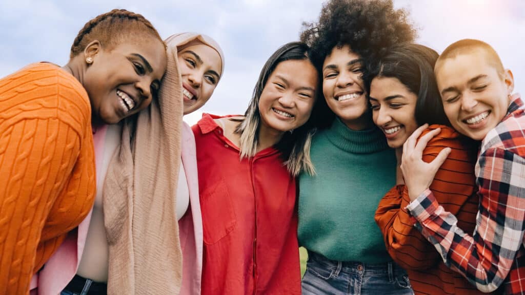 Multiethnic group of women having fun together outdoors