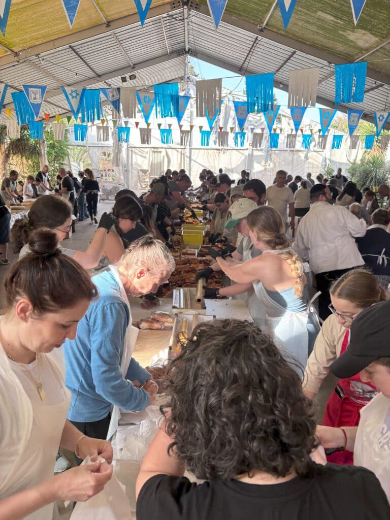 Volunteers assemble schnitzel sandwiches